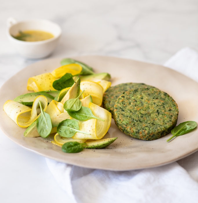 Spinach burger with courgette salad, spinach, avocado and grapefruit lemon vinaigrette