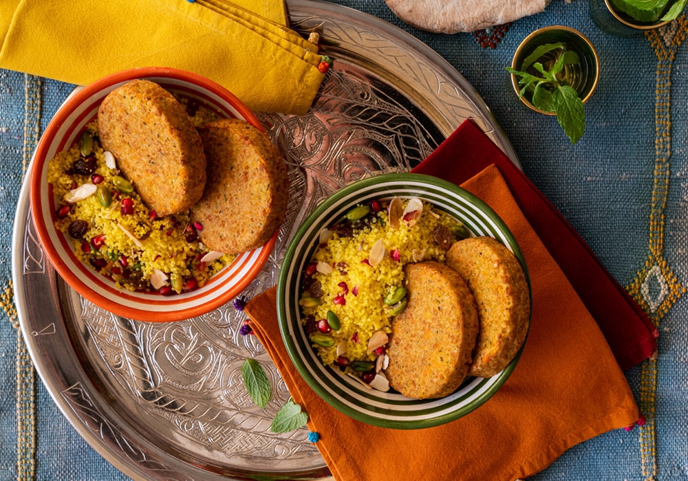 Chickpea burger with saffron couscous and dried fruit